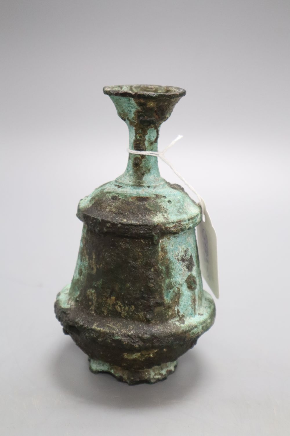 A Roman style oil bottle, height 16cm